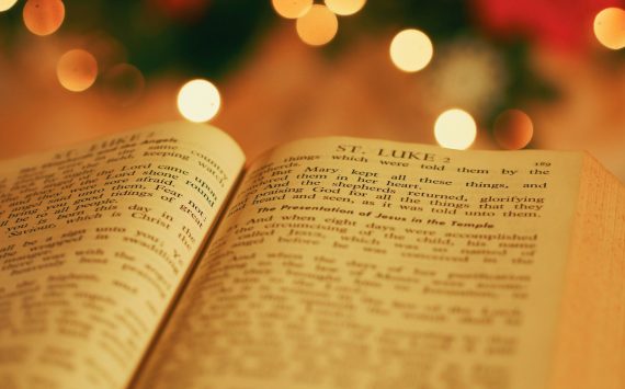 opened bible with bokeh light background